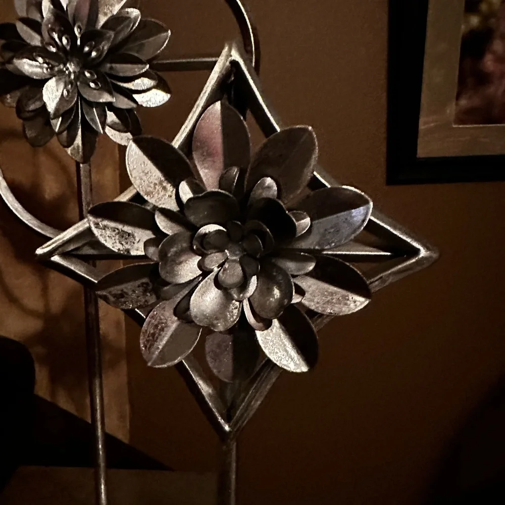 Home decor accents  two silver flowers on pedestal stand